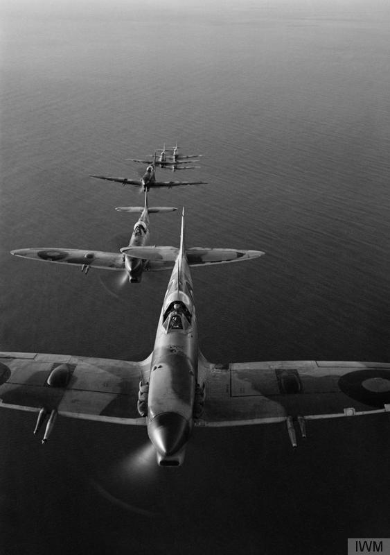 Photo of Spitfires flying in line astern formation.